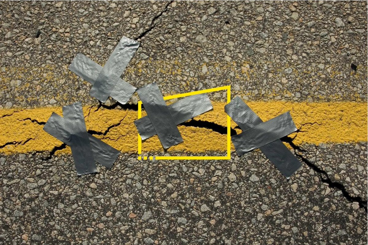 Cracked asphalt features yellow paint and gray duct tape patches, symbolizing quick fixes on a deteriorating surface.